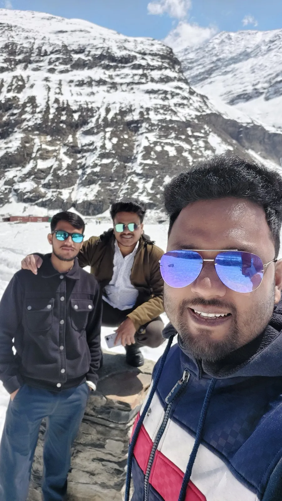 Kulwant and two companions taking a selfie on a snow-covered mountain