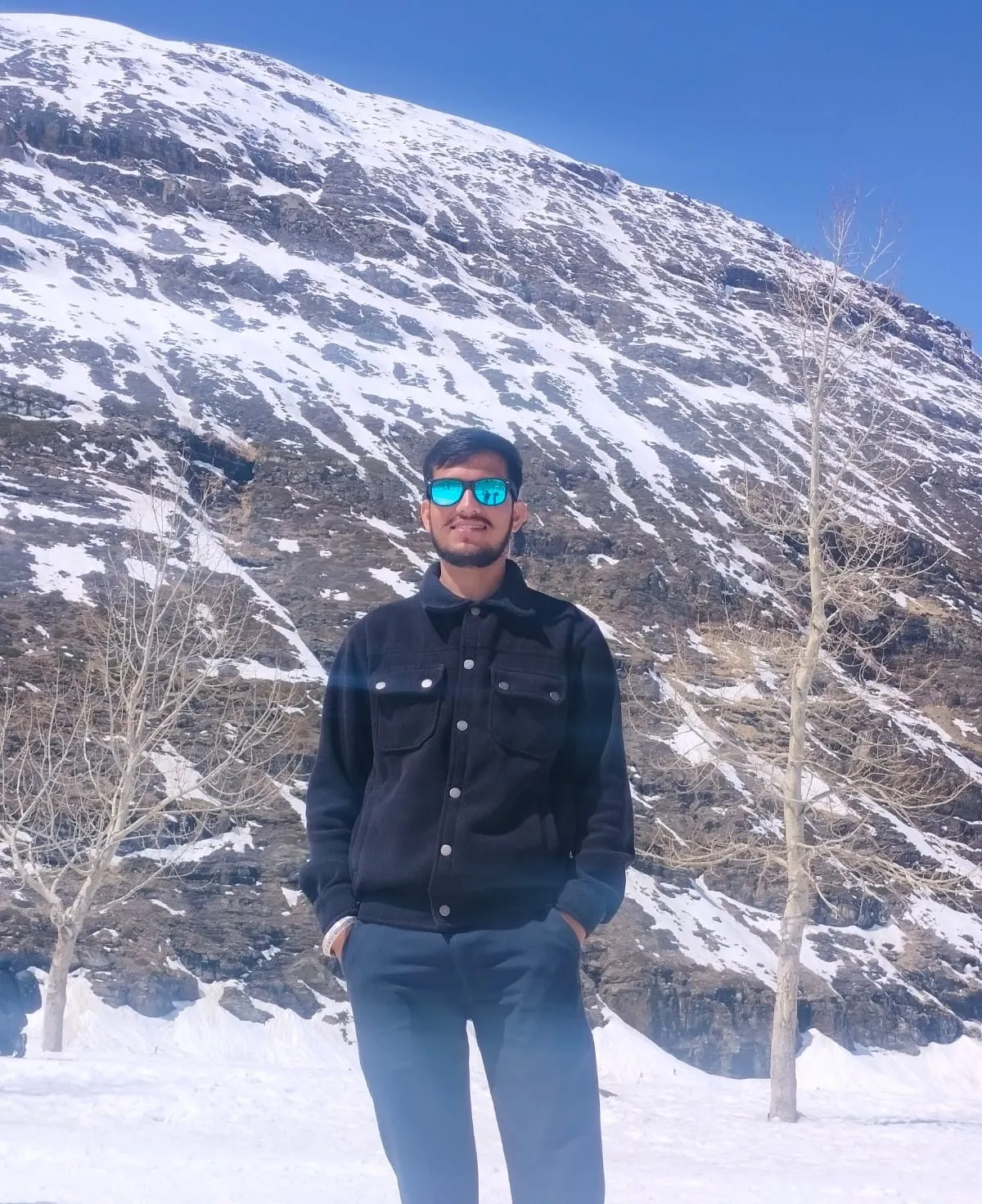 Kulwant standing in the snow near Sissu, Manali